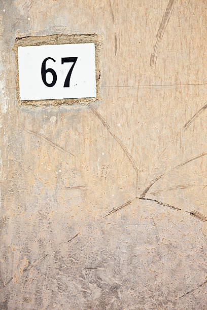 istock 67, Street Number On The Wall 183040386