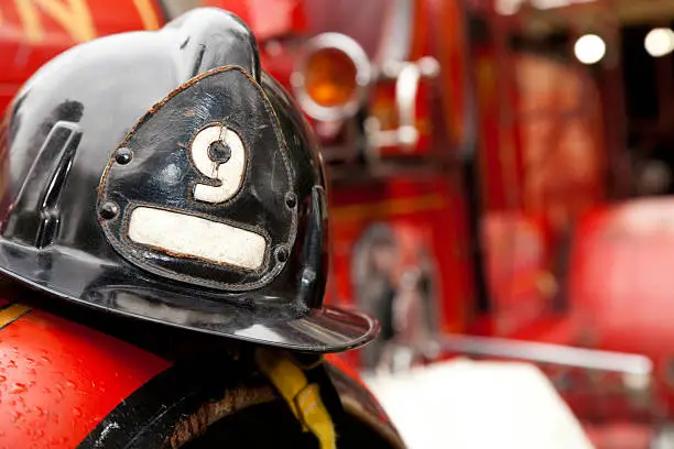 Firefighter Helmet Resting on Firetruck.See more firefighter images: