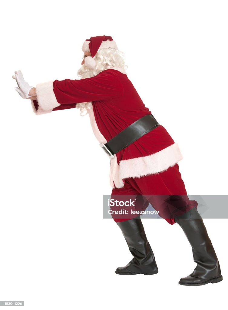 Santa Claus Pushing, on White Background Santa pushing on a blank space, ready for you to insert your item.   Isolated on white. Santa Claus Stock Photo