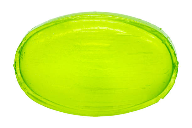 a bright green candy to suck and already unwrapped