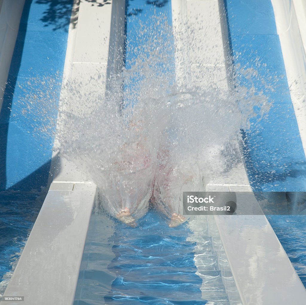 Splashing water Water effect of a shock between man and water after sliding on a tobogan Activity Stock Photo