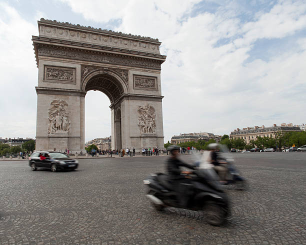 istock Traffic passing around Arc de Triomphe on a summer day 183042036