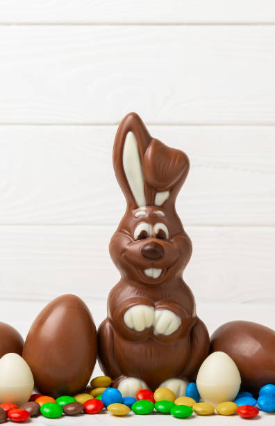 istock Easter chocolate bunny on  table. Chocolate eggs and other sweets. Easter celebration concept. Easter sweets on the table. Place for text. copy space. 1830424064