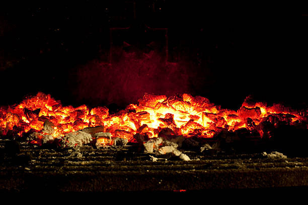 BBQ grill with charcoal on fire.