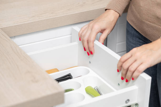 istock woman's hand opens a kitchen drawer with cutlery. 1830425200