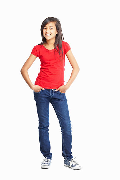 Cute little girl posing with hands in pockets Full length of a cute little girl posing with hands in pockets isolated against white background pre adolescent child stock pictures, royalty-free photos & images