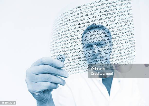 Scientist Holding A Digital Rendition Of A Dna Code Stock Photo - Download Image Now