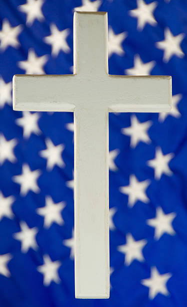 istock White Cross and American Flag 183043286