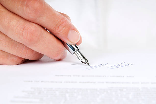 Signing a contract stock photo