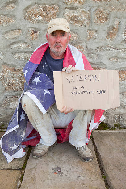 istock Old Beggar Wrapped In The Stars And Stripes 183043958