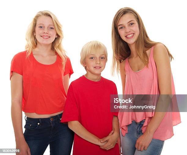 Two Teenage Girls With Younger Brother Stock Photo - Download Image Now - Blond Hair, Brother, Teenage Girls