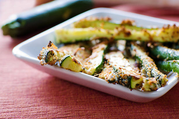 istock Baked zucchini fried on a white square plate 183044285