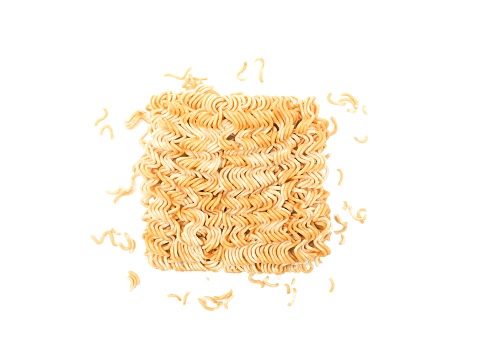 Blocks of dry instant noodles placed isolated on a white background.