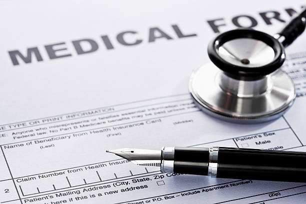 istock Stethoscope and Pen on a Medical Form 183044646
