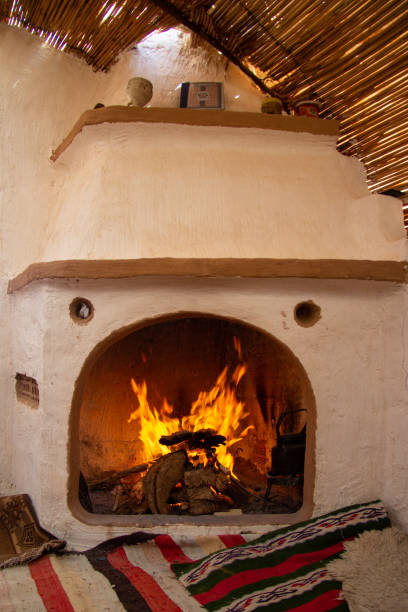 istock Lighting a fire inside the traditional chimney at home 1830446973