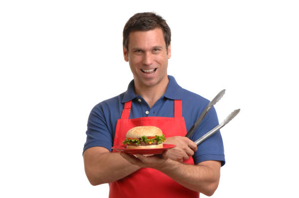 istock Proud barbecue BBQ Chef with Hamburger Isolated on White Background 183045024