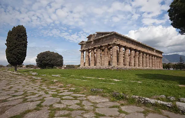 "Paestum is an ancient Greco-Roman city in the Campania region of southern Italy (40 km south of Salerno). Settled by Greek colonists in the 6th century BC, Paestum was later occupied by Lucanians, Romans and Christians. Malarial swamps led to the abandonment of the city in the 9th century AD.Paestum boasts three well-preserved Doric Greek temples, ruins of ancient houses and a museum of Greek artifacts.For more like this and related images, see my 'Ancient Italy' collection."