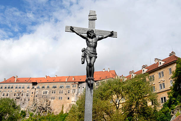 istock Iron Crucifix in front of Cesky Krumlov castle 183045674