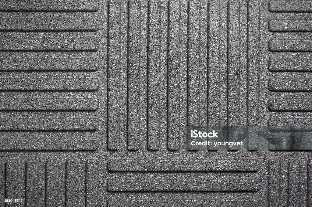 Black rubber mat Closeup of the pattern of a black rubber floor mat.See related: Doormat Stock Photo