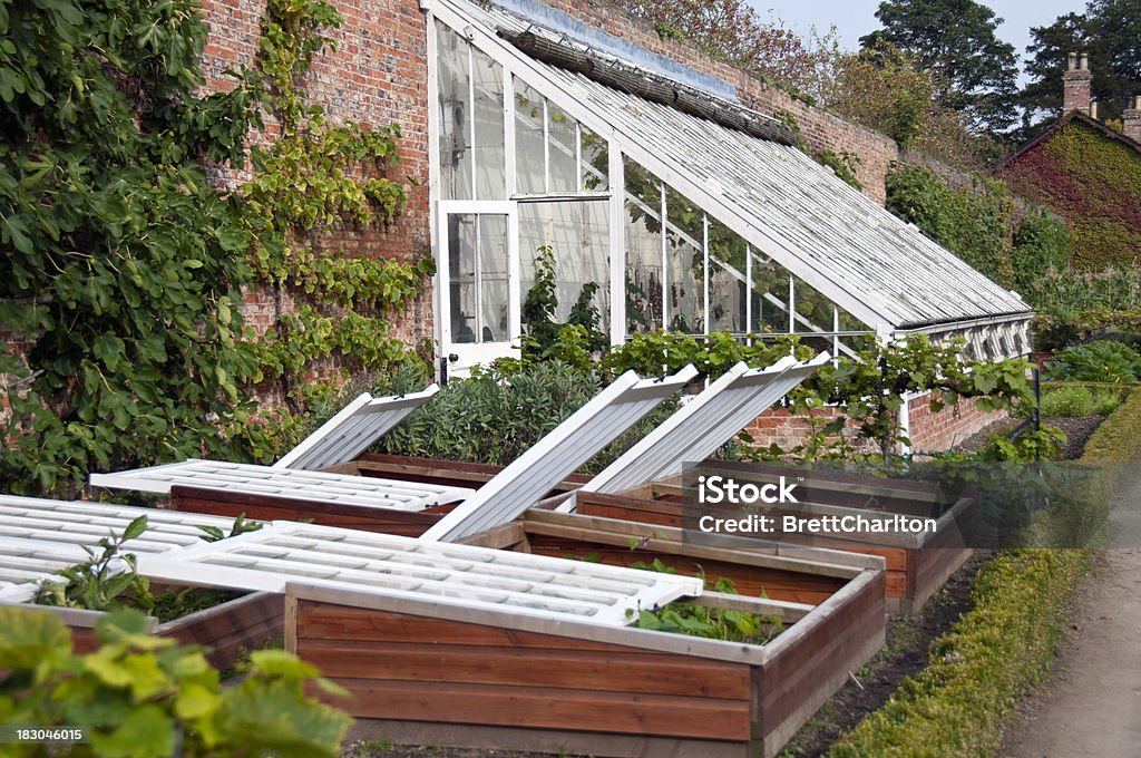 The Greenhouse Cold frames and Greenhouse in a large well established country vegetable garden Cold Frame Stock Photo