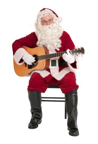 Santa Claus playing a folk guitar. Isolated on white.Click below to see a lightbox of all my Santa images: