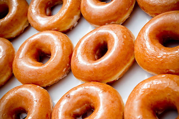 Dozen Glazed Donuts stock photo