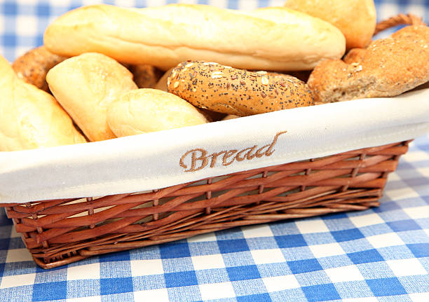 istock wicker basket, full of fresh bread products 183046517