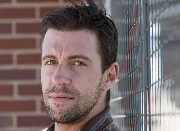 istock Handsome Man Against Chained Link Fence 183046687