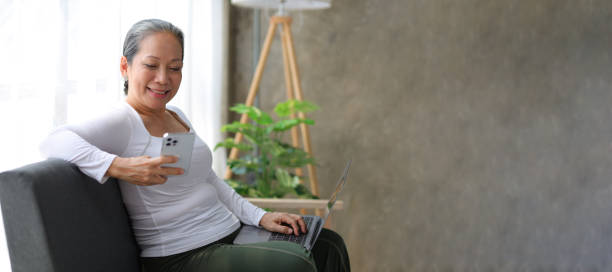 istock Woman using mobile phone shopping online. 1830468432