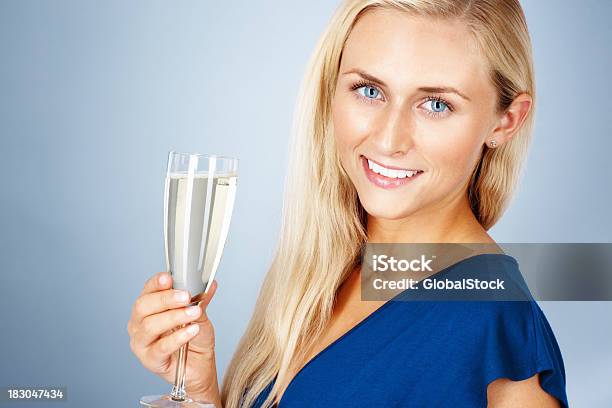 Beautiful Young Lady Smiling And Holding A Glass Of Champagne Stock Photo - Download Image Now