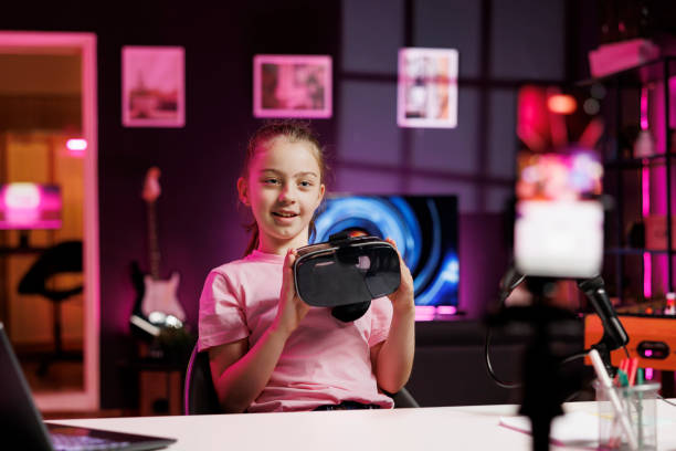 istock Young media star showcasing high tech VR goggles 1830476173