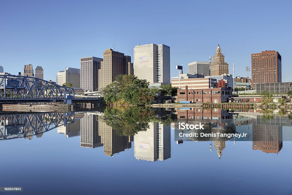Newark New Jersey Newark cityscape refection along the banks of the Passaic River. Newark is the largest city in New Jersey. Newark is one of largest rail and air hubs in the nation. Newark is known for its glamorous performing arts venues, premium outlet mall, museums, and the argest collection of cherry blossoms. New Jersey Stock Photo