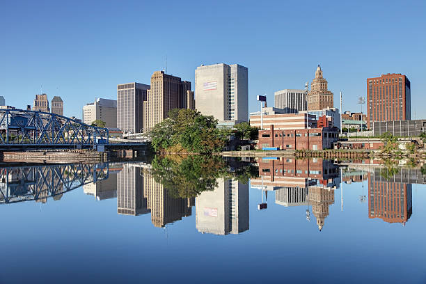 Newark New Jersey Newark cityscape refection along the banks of the Passaic River. Newark is the largest city in New Jersey. Newark is one of largest rail and air hubs in the nation. Newark is known for its glamorous performing arts venues, premium outlet mall, museums, and the argest collection of cherry blossoms. new jersey photos stock pictures, royalty-free photos & images