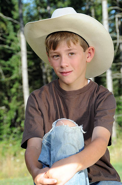 istock Young Boy with Cowboy Hat Outside 183047850