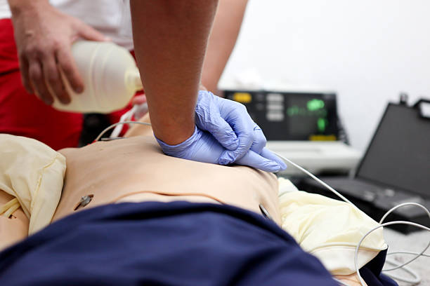 istock Doctor giving patient chest compressions 183048268
