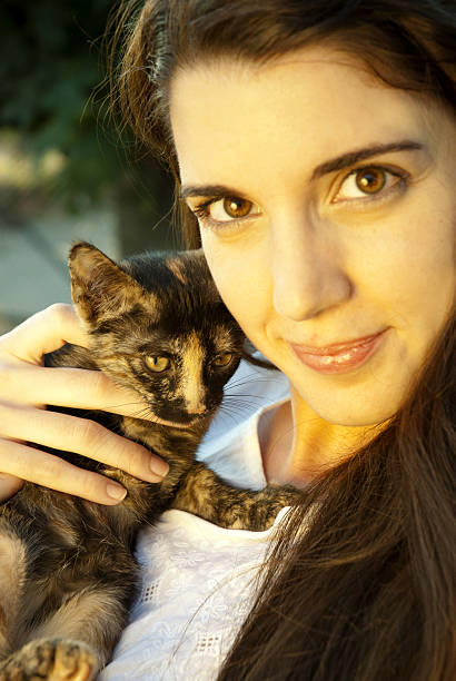 istock Pretty girl holding cat 183048578