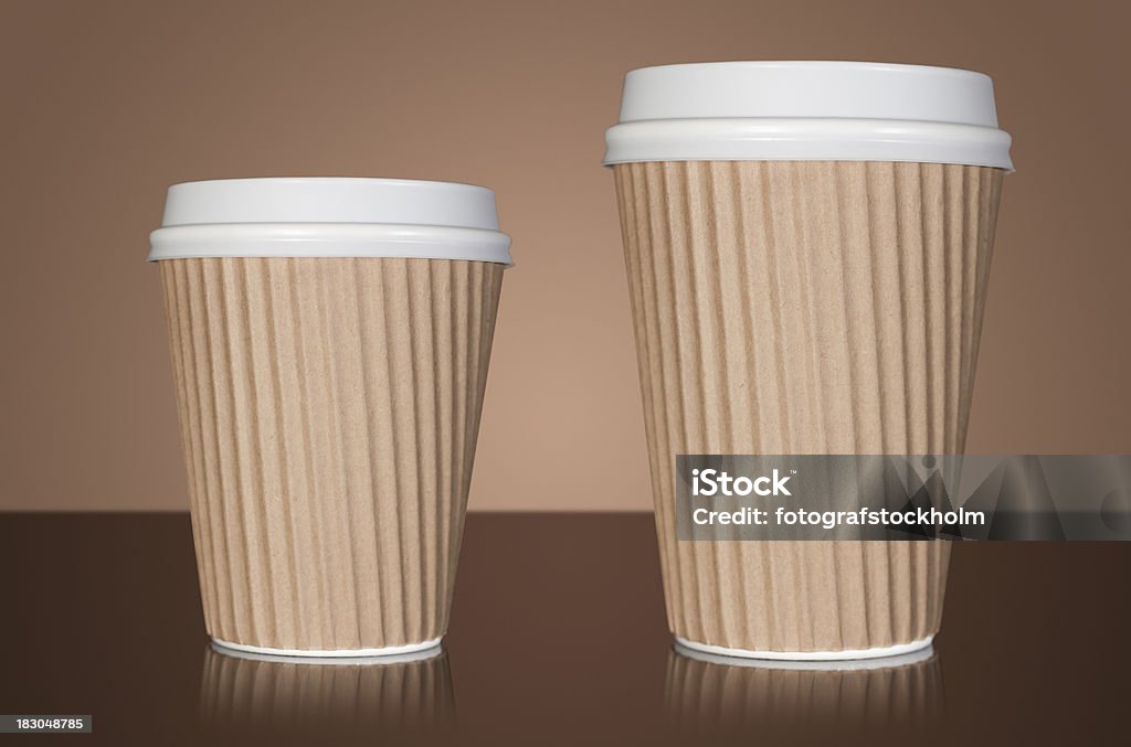 Small and large takeaway coffee Two takeaway coffee cups. Small and large. Mocha brown background. Black Color Stock Photo