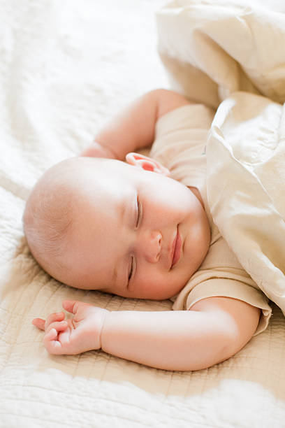 istock Sweet Dreams - Sleeping Smiling Baby 183050580