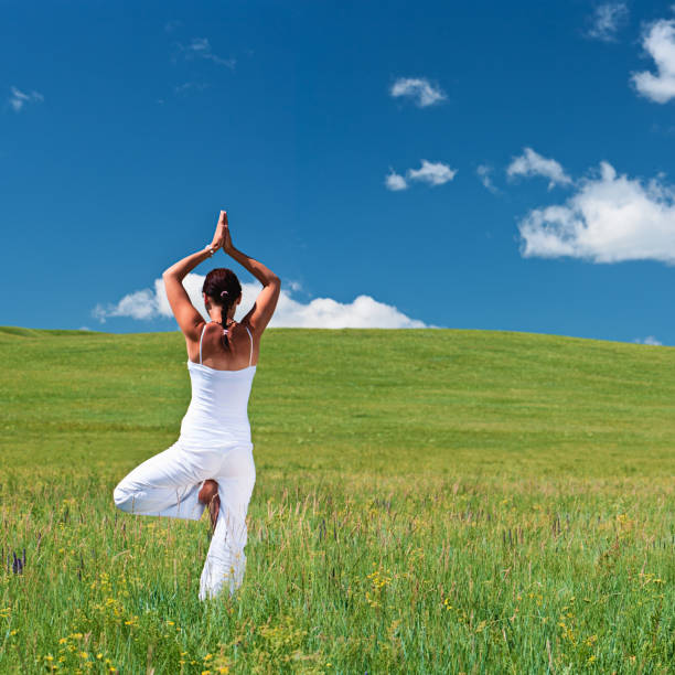istock Young woman practicing yoga 183050869