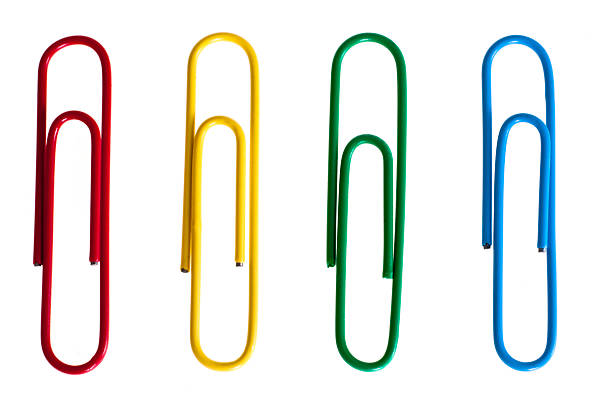 Paper clips Selection of multi-colored paper clips on isolated white background. paper clip stock pictures, royalty-free photos & images