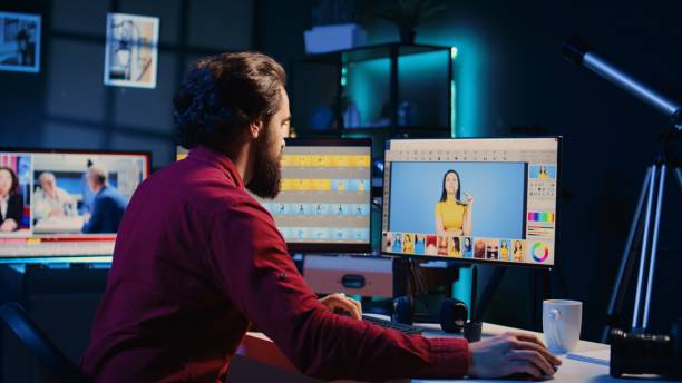 istock Photo editor color correcting photographs in creative studio using graphic tablet, 1830512865