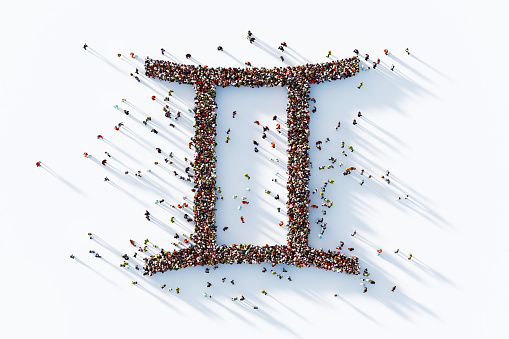 Human crowd forming Gemini Sign on white background. Horizontal  composition with copy space.