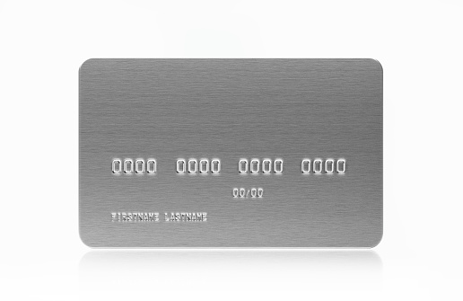 Silver colored credit card on white background. Horizontal composition with copy space.