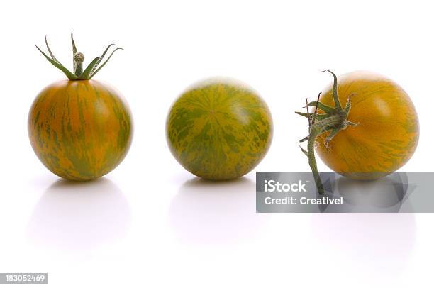 Zebra Tomatos Stock Photo - Download Image Now - Heirloom Tomato, White Background, Zebra Tomato