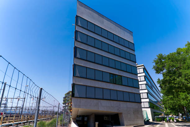 istock Looking up modern facade of administration building at Swiss town. 1830530052
