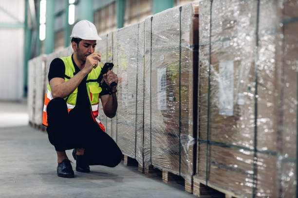 istock Warehouse worker working in warehouse storage. Foreman or worker work at factory site check up products in site. Inventory worker working in  factory Storehouse 1830532305