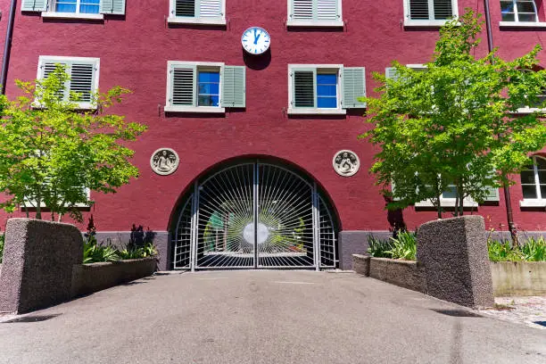 Photo of Scenic view of beautiful decoration of gate at apartment building at Swiss town.