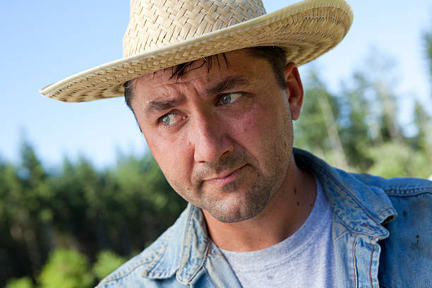 istock Male Farmer wearing hat on farm 183053315