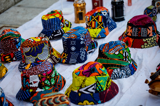 Multicolored African Style Hats Being Sold on Sidewalk on Carnival.