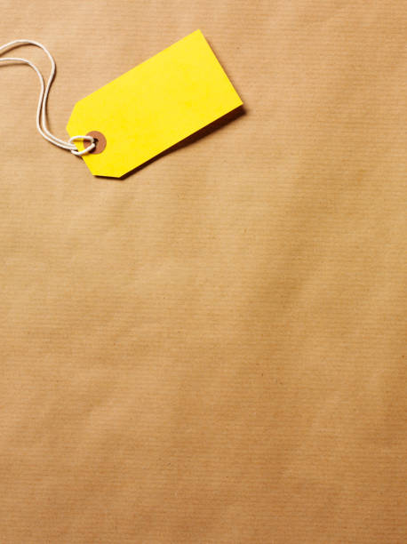 istock Yellow Label on Brown Paper 183053716